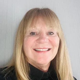 Head-and-shoulders portrait of Deborah Marsh, Finance and Governance Secretary for the NHS Retirement Fellowship, smiling in front of a neutral indoor background.