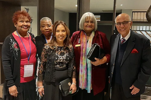 Five NHS Retirement Fellowship members from the St George’s branch, dressed in smart casual attire, attending the NHSRF Annual General Meeting